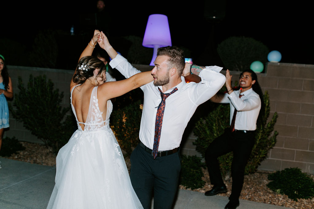 Bride and Groom Dancing during backyard wedding reception. 
