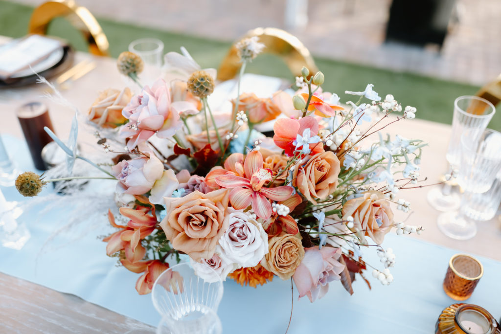 The Ultimate Wedding Timeline. Colorful floral arrangement for center pieces of the table 