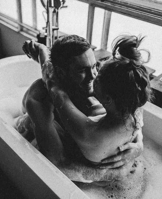 Couple hugging in the bath 