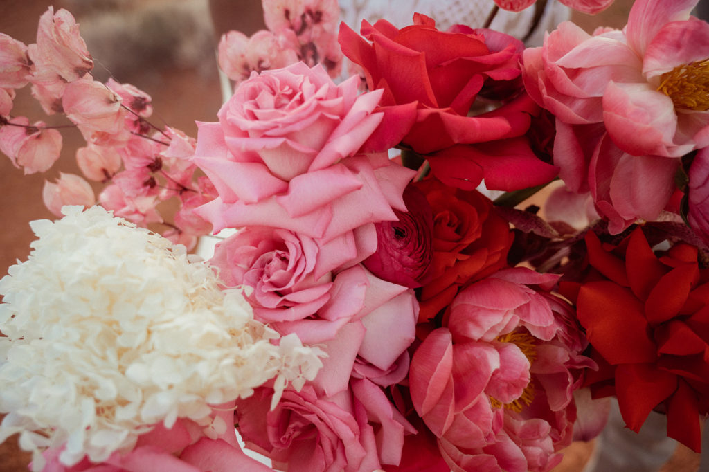 Bold & Colorful in the Vegas Desert. Monochromatic magenta florals in the brides wedding bouquet 