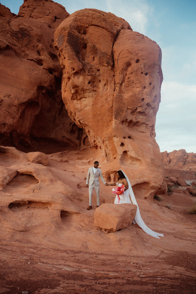 Newlyweds seek off to adventure the mountains in valley of fire 