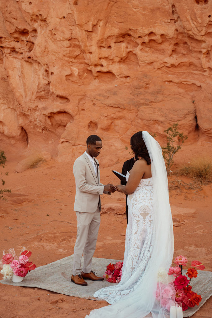 The bride and groom exchange wedding rings