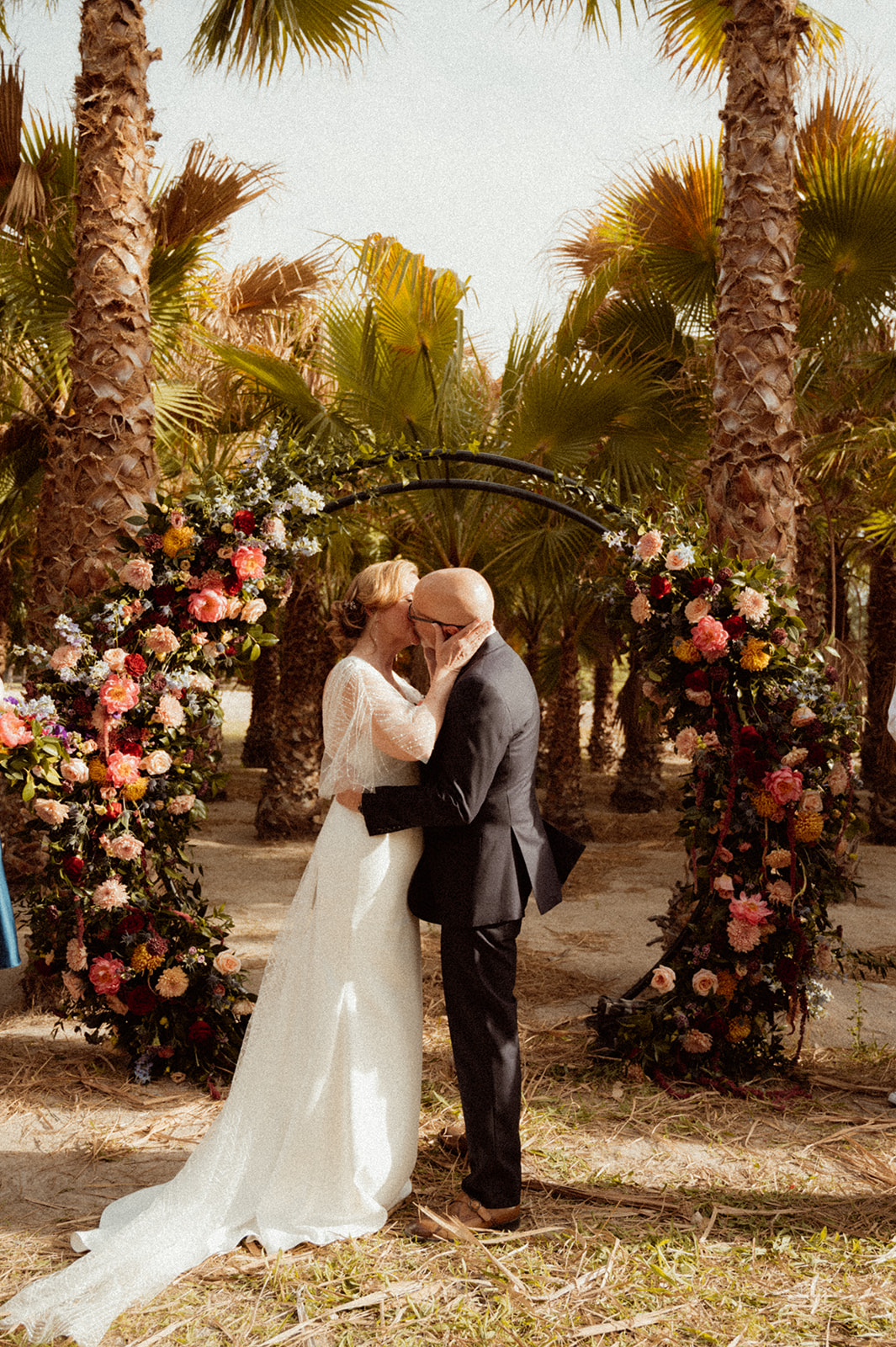 Newlyweds first kiss for Bold Jewel Toned & Iconic Wedding