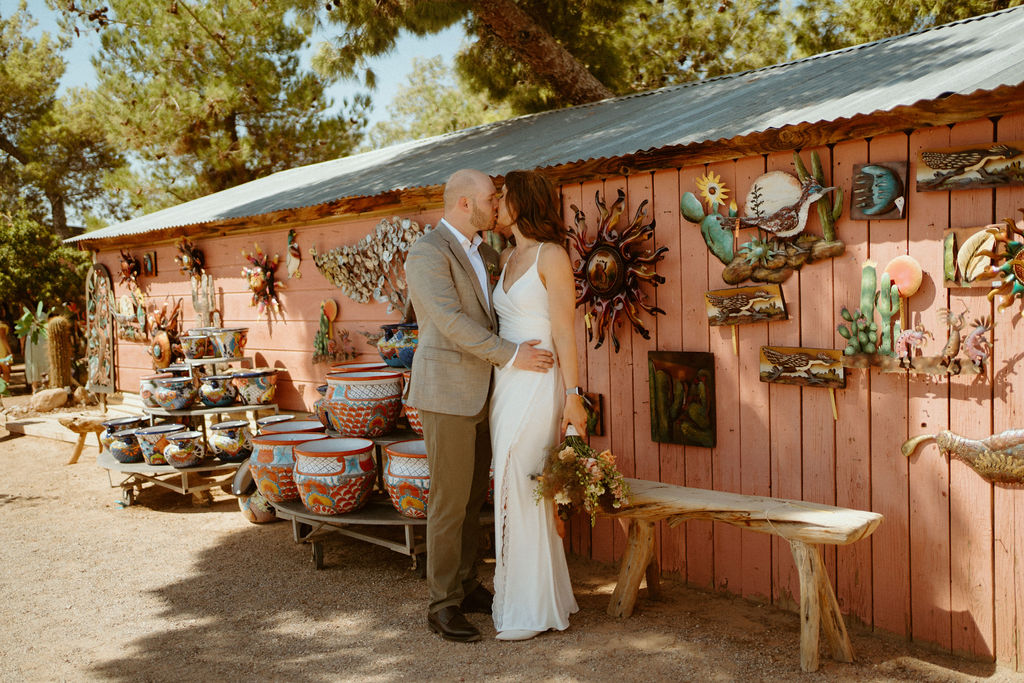Newlywed standing outside Cactus Joe's retail after Elopement