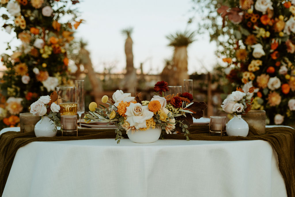 Fall inspired sweetheart table with dramatic florals