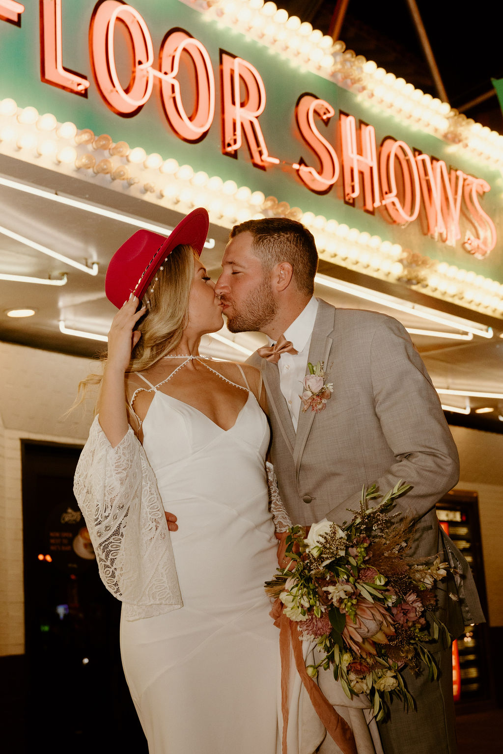 Red Rock Desert & Neon Vegas Lights. Newlywed kiss in front of the El Cortez hotel in Downtown Las Vegas 