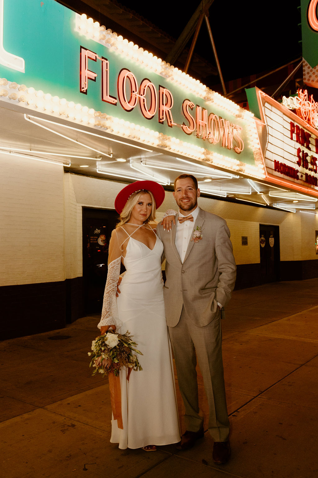 Newlyweds head downtown Las Vegas on Freemont street for some Vegas inspired photos.