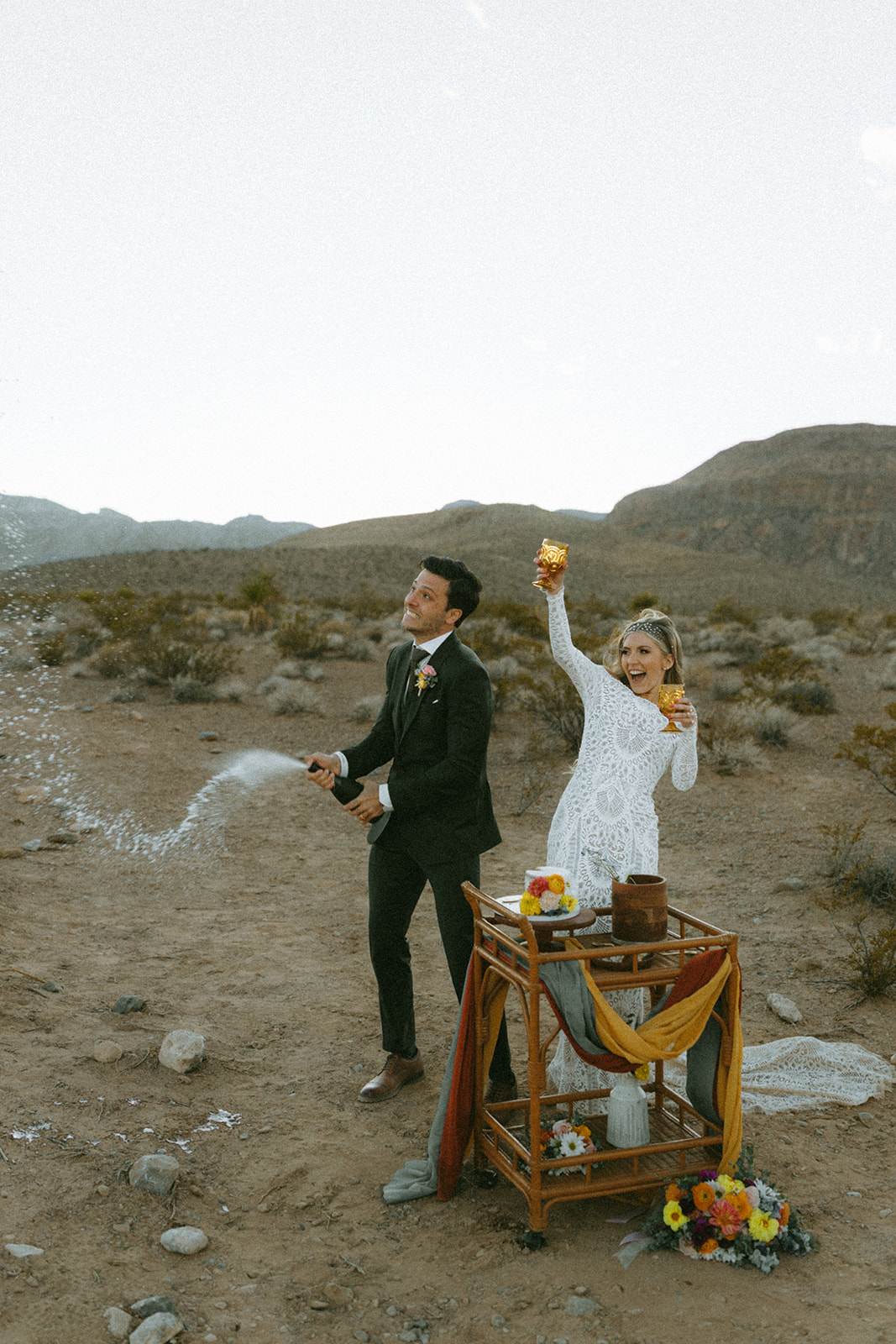 Newlyweds pop champagne in celebration of tying the knot 