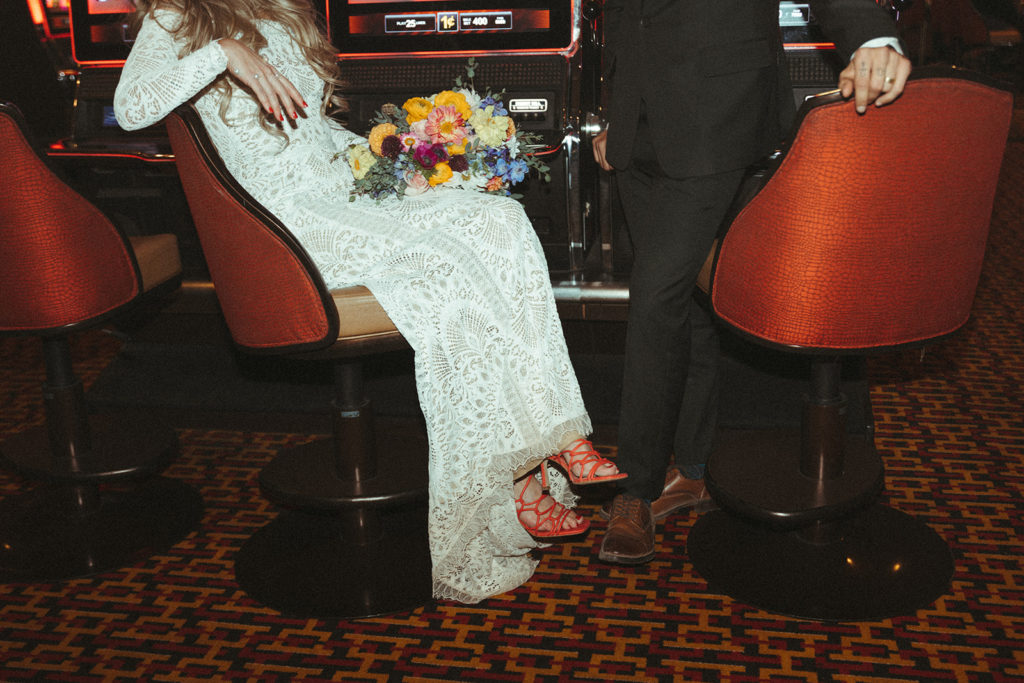 Bride and groom at the slot machines in Las Vegas Casino