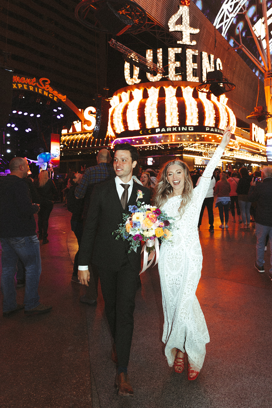 Retro & Colorful Micro-Wedding at the Doyle. Newlyweds outside the 4 queens hotel and casino in Las Vegas 