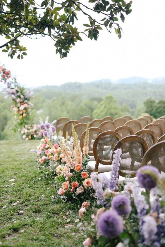 Ceremony aisle with an row of colorful wildflowers 