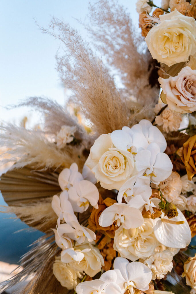 Close up of Boho florals with orchids, roses, and Pampas 