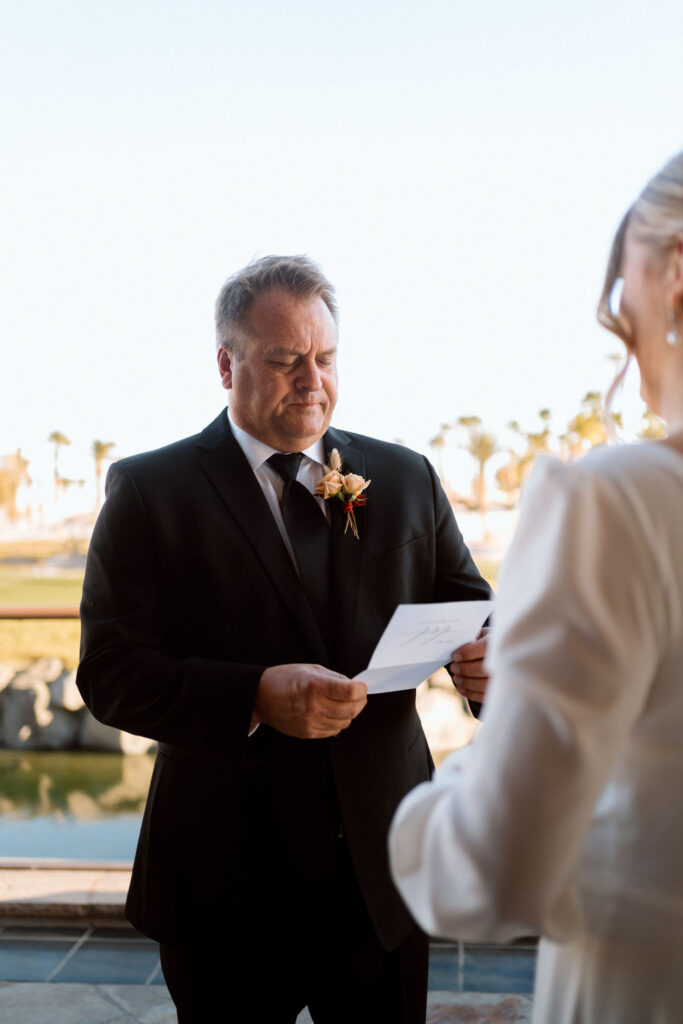 Brides father reading her personalized letter the first time. 