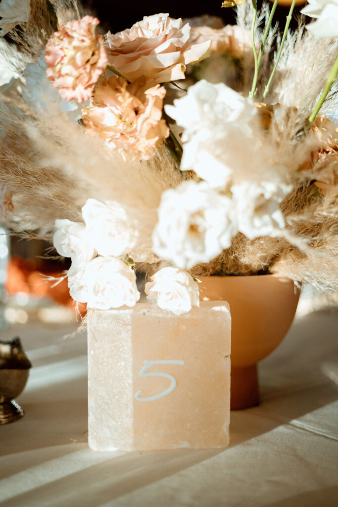 Close up of the boho styled rock table number. 