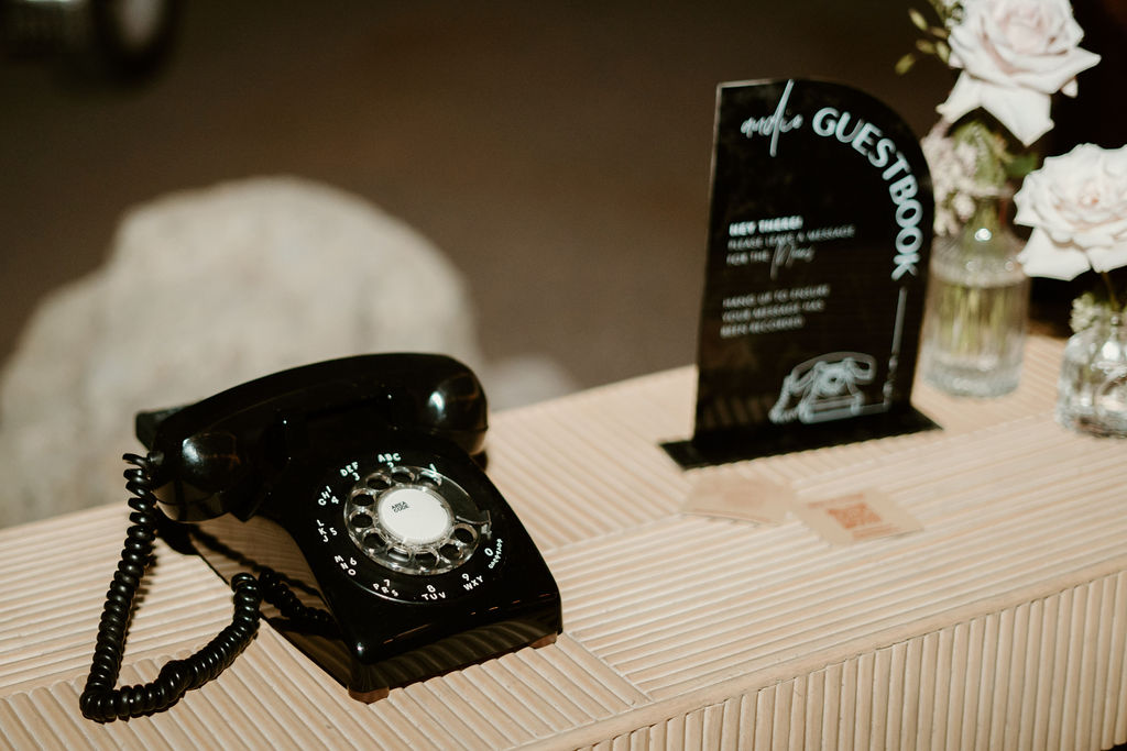 Old school dial phone guest book to leave a voicemail to the bride and groom. 