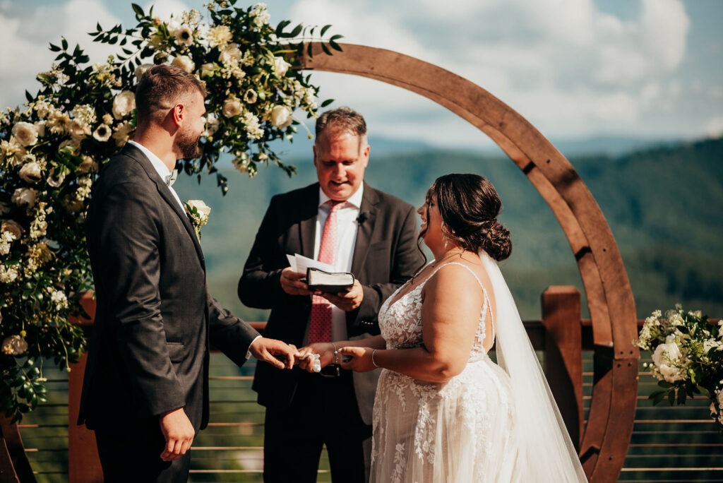 Rolling Hills and Tennessee Whiskey. Bride and groom exchange rings 