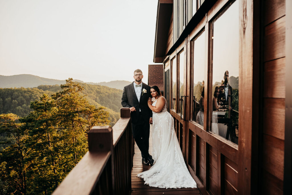 Rolling Hills and Tennessee Whiskey. Newlywed photos on the patio of the magnolia venue surrounded in the great smokey mountains 