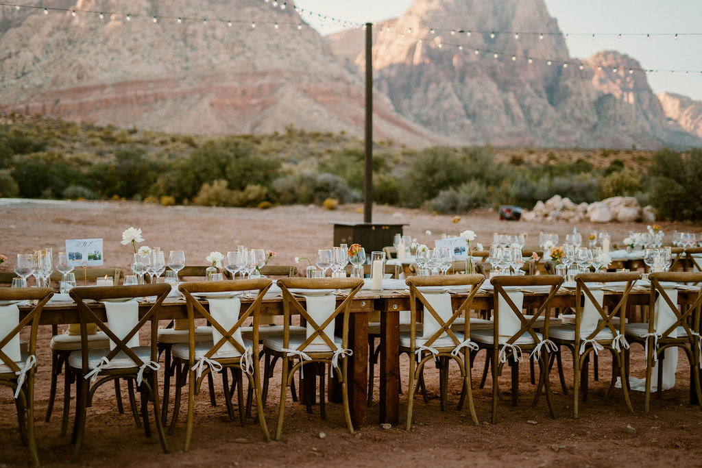 Red Rock Canyon Mountains in background with decorated dinner table for guest. 