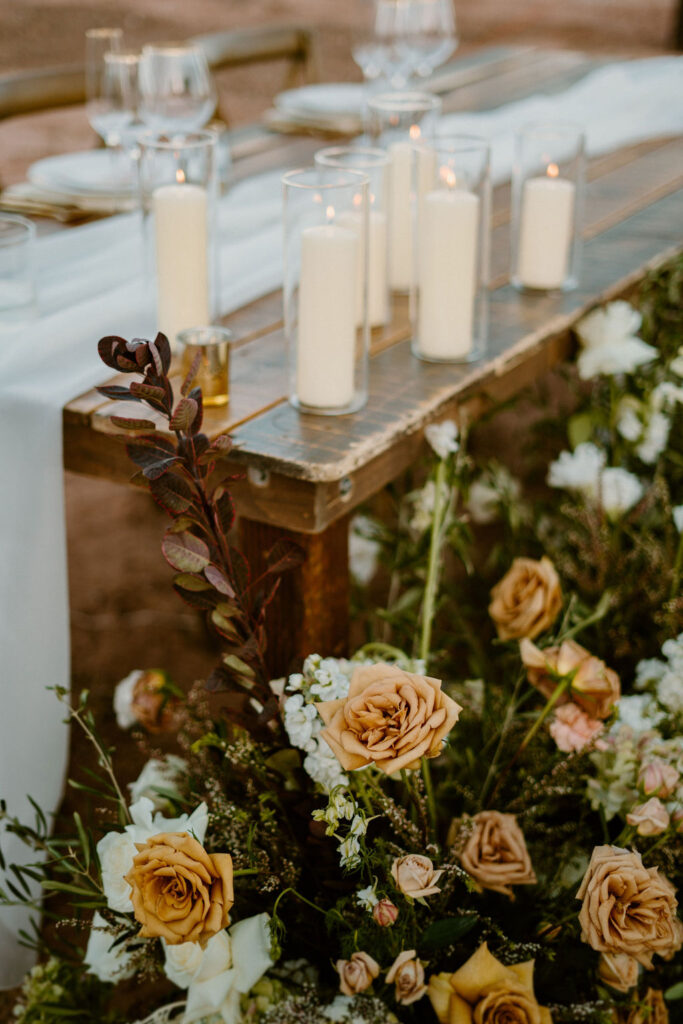 Timeless Red Rock Canyon Wedding wuth candles and toffee rose floral decoration