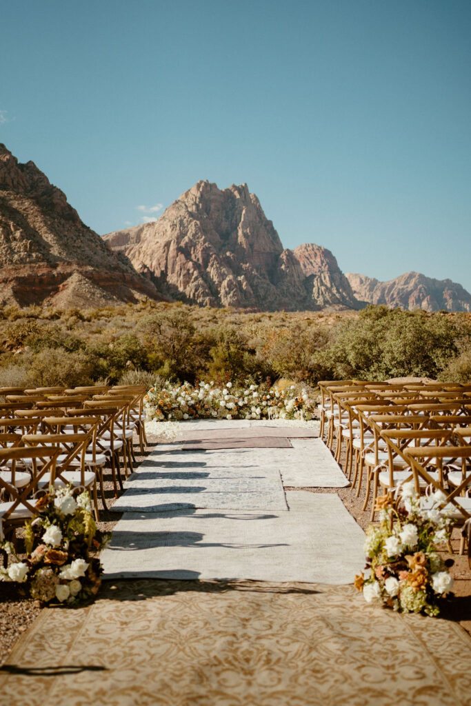Timeless Red Rock Canyon Wedding view of the ceremony with chairs and floral display