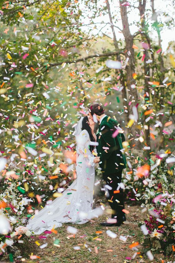 Newlyweds use a bio-digrable confetti as they walk down the aisle after ceremony