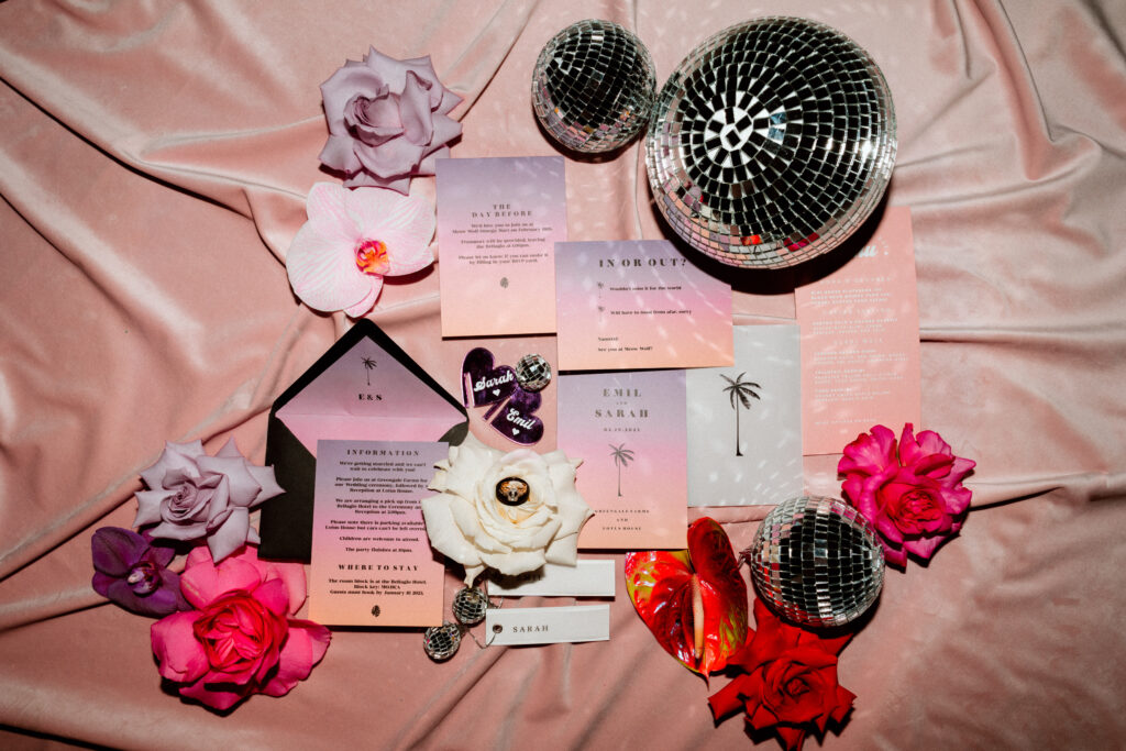 Fun and funky pink invitation suite with bright pink, red, and purple roses with disco balls. 