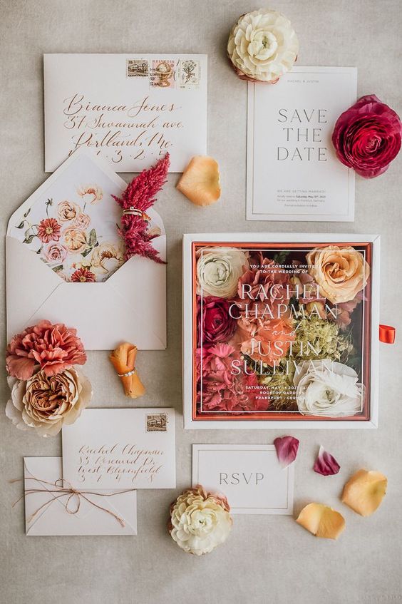 Different Parts of an Invitation Suite with beautiful pink and rose colored invitations. 