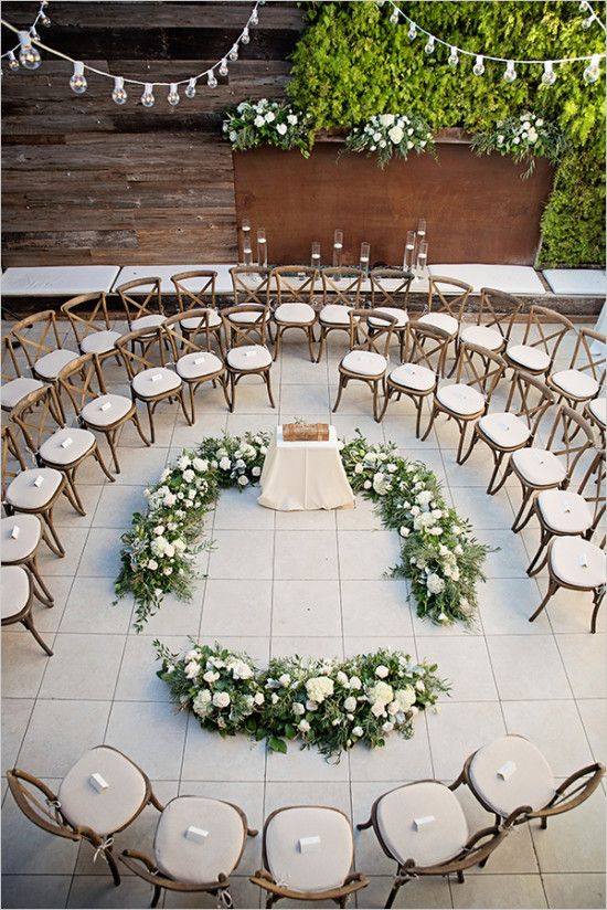 Aisle: Circle Or Runway? A unique circular runway surrounding a table and circular floral ground arch. 