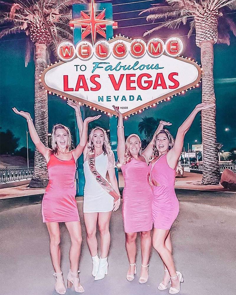 5 Trendiest Bach Party Themes Small group of bachelorette party cheering in front of the Las Vegas Sign in pretty and pink theme