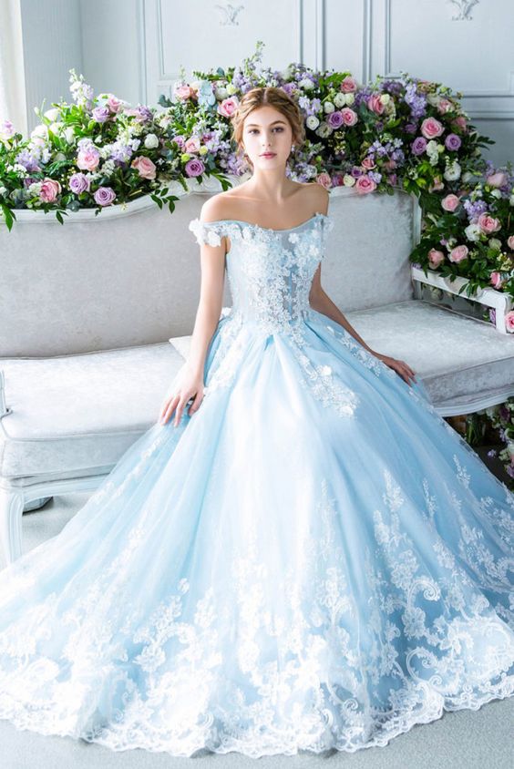 The Ultimate Guide to Different Types of Wedding Dresses: From Classic to Contemporary. Beautiful baby blue ball gown wedding dress with white lace and sown on tiny white flowers. 
