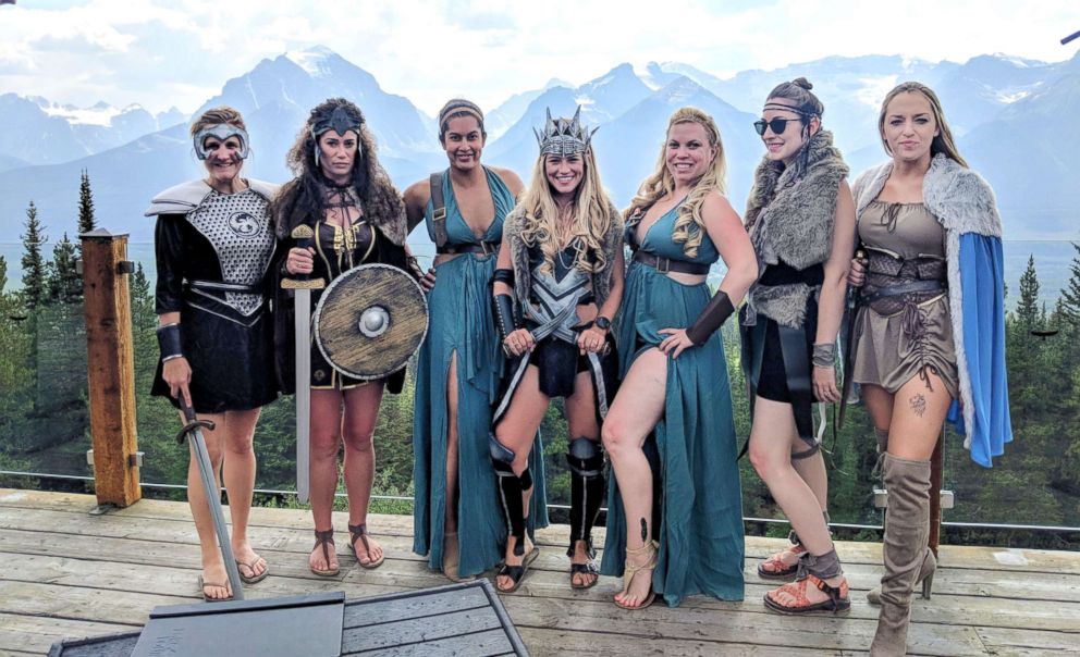 5 Trendiest Bach Party Themes a group of 7 women wear warrior princess costumes for this bachelorette themed party. The bride wears a crown on her head. 
