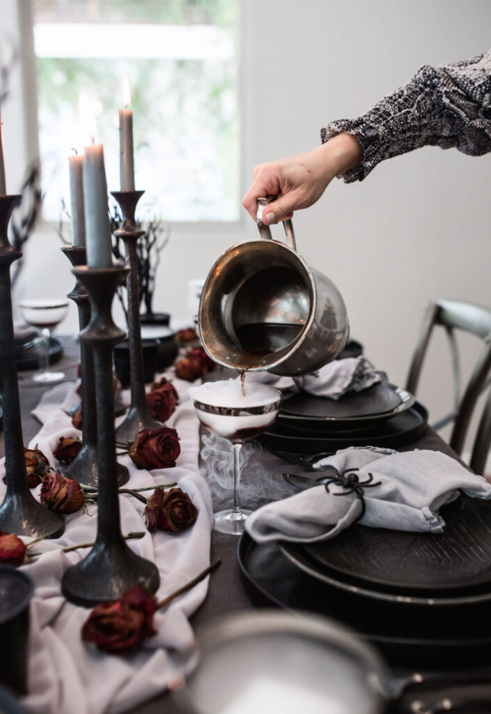 Halloween Tablescape with grey, blacks and dried roses 