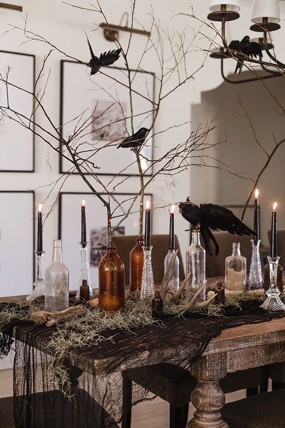 Twigs, Crows, and Candles in glass bottles for Halloween Decor 