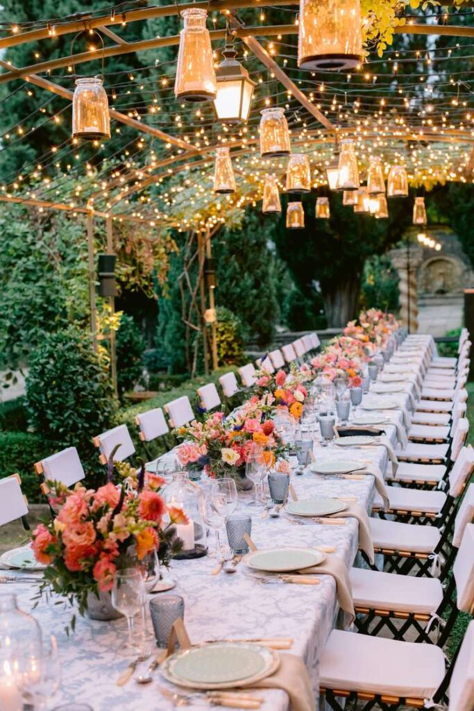 The Ultimate Garden Party Wedding: Your Dream Day Blossoms Here! Garden Party tablescape with lights and lanterns above 