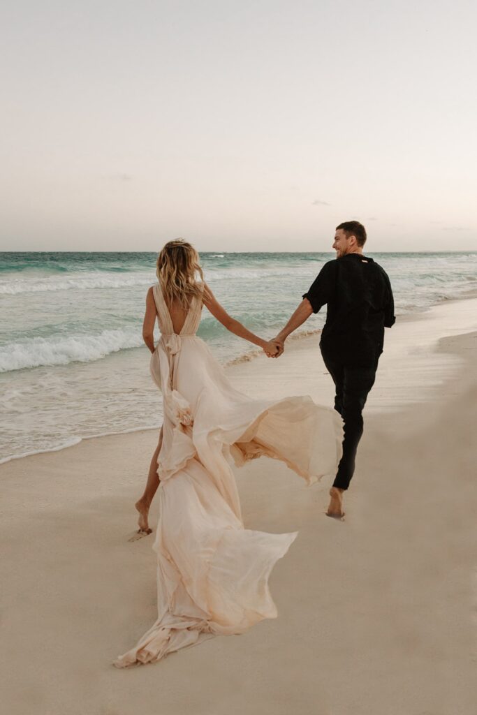 Love Beyond Borders: Top Wedding Destinations of 2024 That Will Steal Your Heart! Newlyweds running on beach in Tulum 