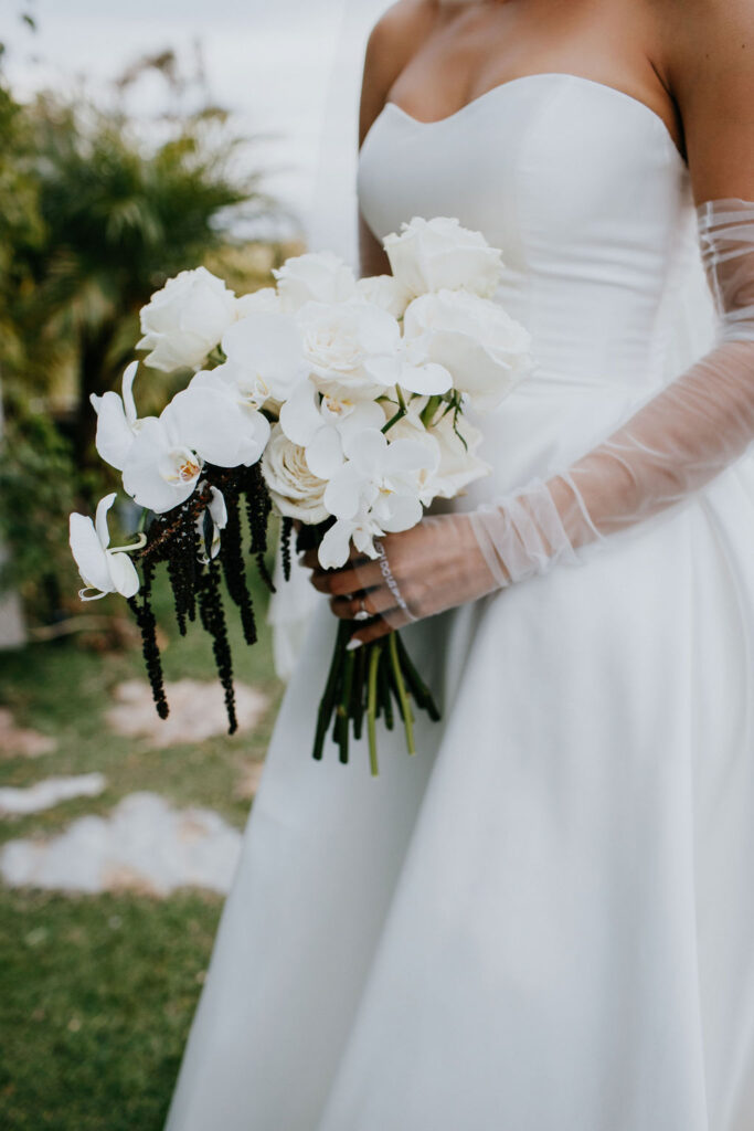 Bride holding all white bouquet