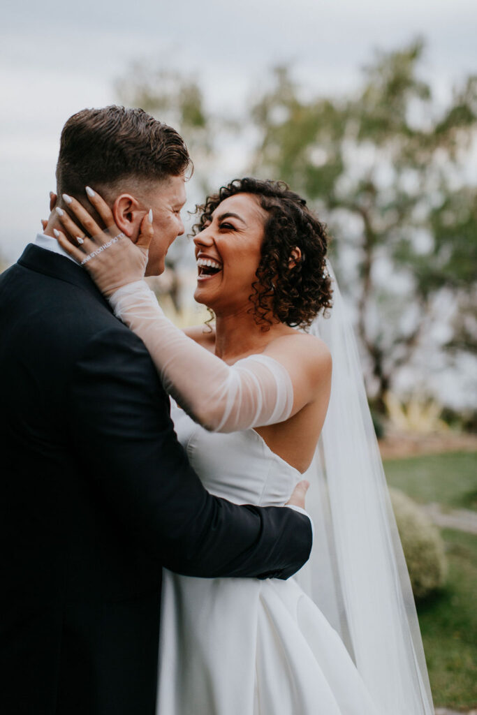 Unleash the Magic: Why Your First Look Should Steal the Show. Bride smiling at groom 