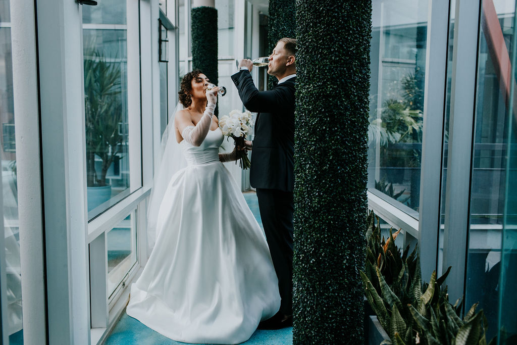Unleash the Magic: Why Your First Look Should Steal the Show. Bride and groom having champagne toast