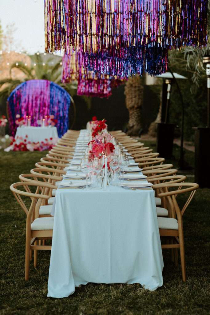 Colorful wedding tablescape with streamers 