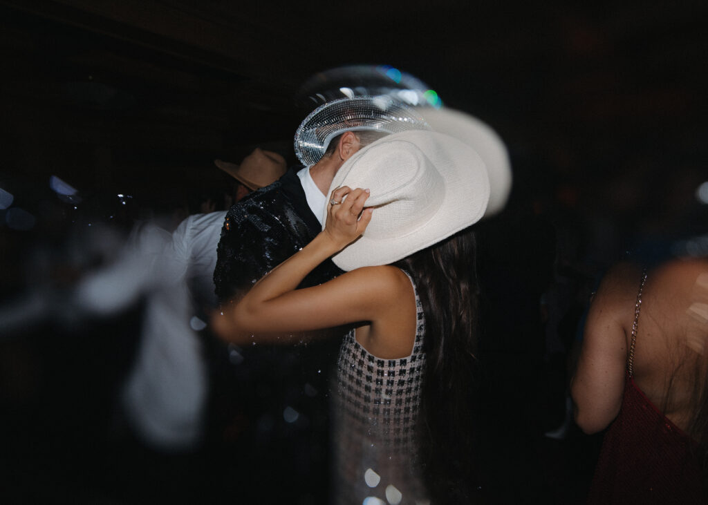 Trend Alert 2024: A Wedding Revolution is Upon Us! Newlyweds with Cowboy hats at afterparty 