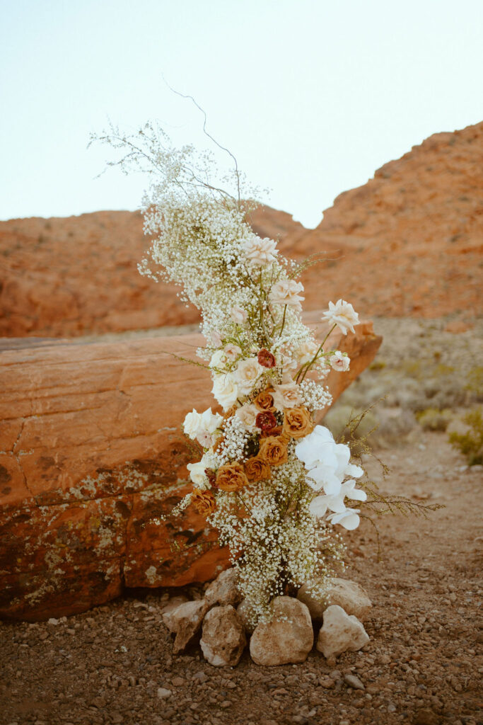 a beautiful foral arch for the rust orange wedding
