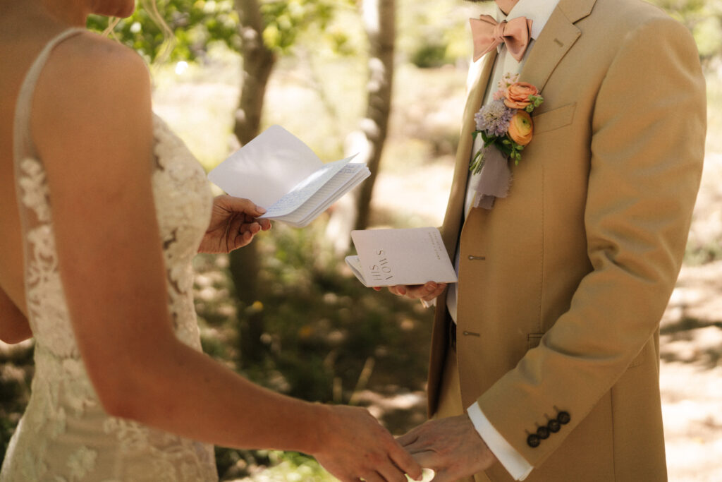 Beyond Vows: The Epic Zion National Park Wedding bride and groom reading their vows
