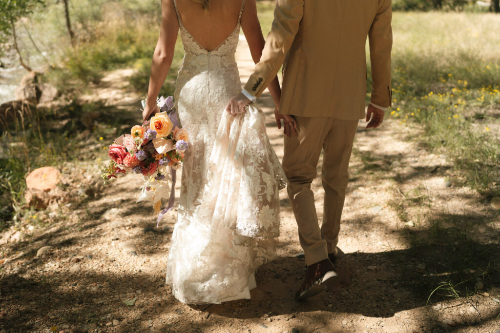 Beyond Vows: The Epic Zion National Park Wedding bride and groom walking to ceremony