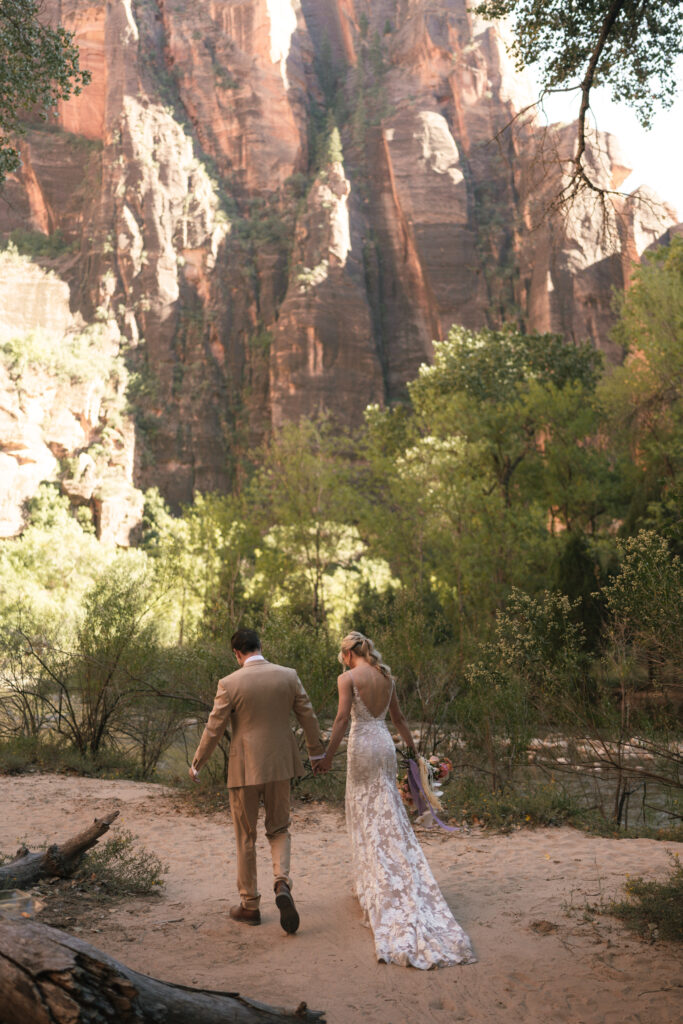 Beyond Vows: The Epic Zion National Park Wedding bride and groom by the river