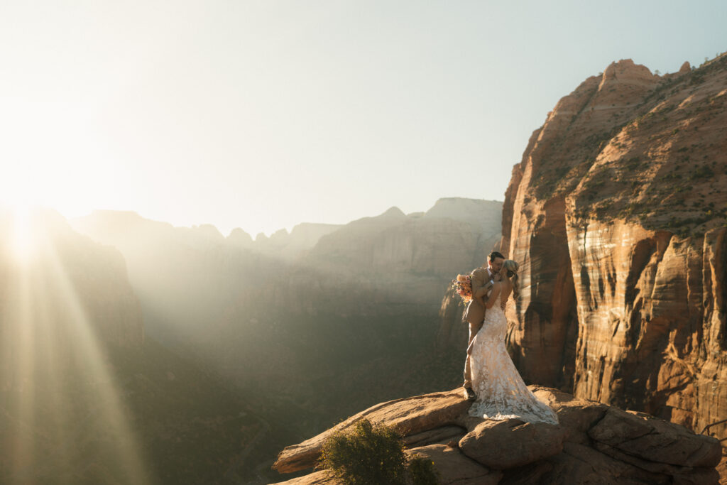 The Epic Zion National Park Wedding Bride and Groom hiking after ceremony