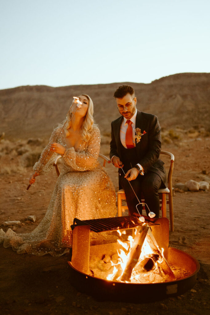 The newlywed couple enjoying S'mores by the Fire
