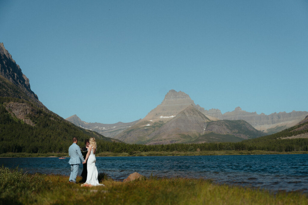 Glacier National Park Wedding, Niki Day Creative the amazing view as the bride and groom get married