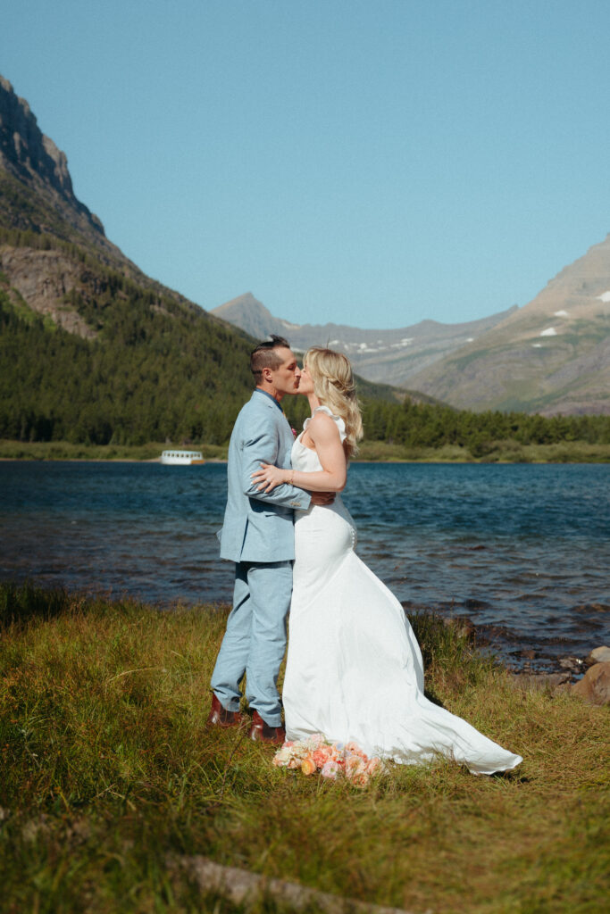 Glacier National Park Wedding, Niki Day Creative the first kiss as a married couple