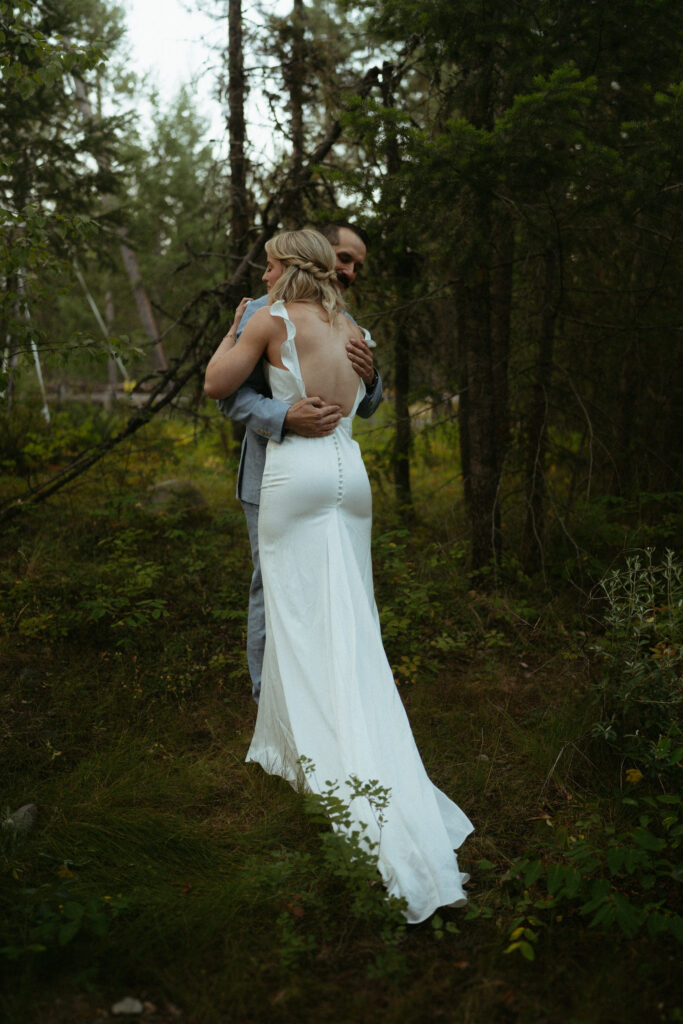 Glacier National Park Wedding, Niki Day Creative bride and groom embracing