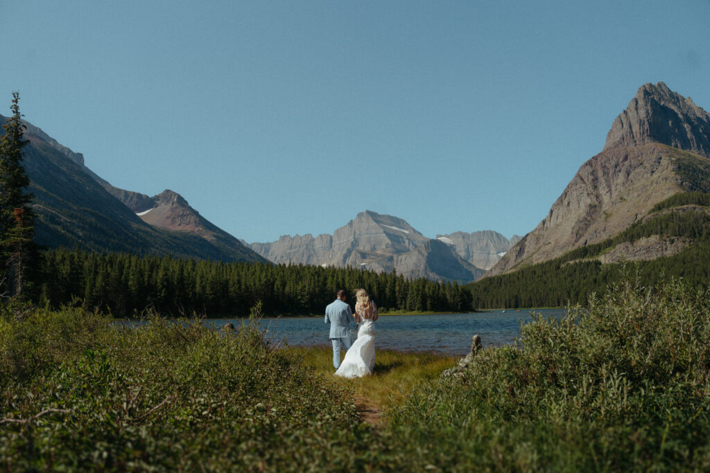 Glacier National Park Wedding, Niki Day Creative the couple admiring the view